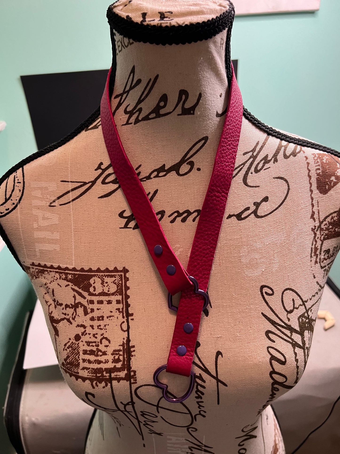 Leather slip choker necklace with hearts.