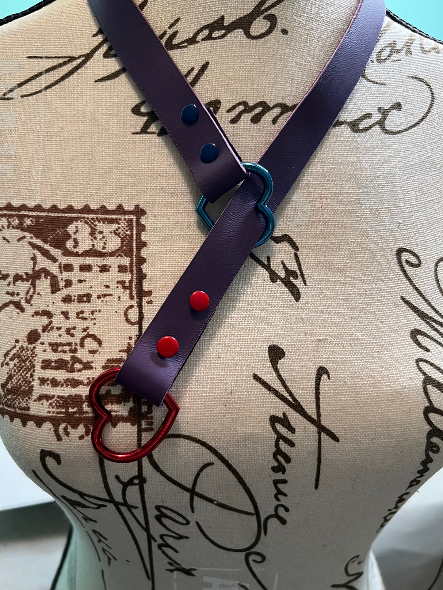 Leather slip choker necklace with hearts.